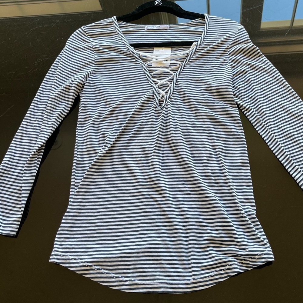 Brand new blue and white striped long sleeve shirt.